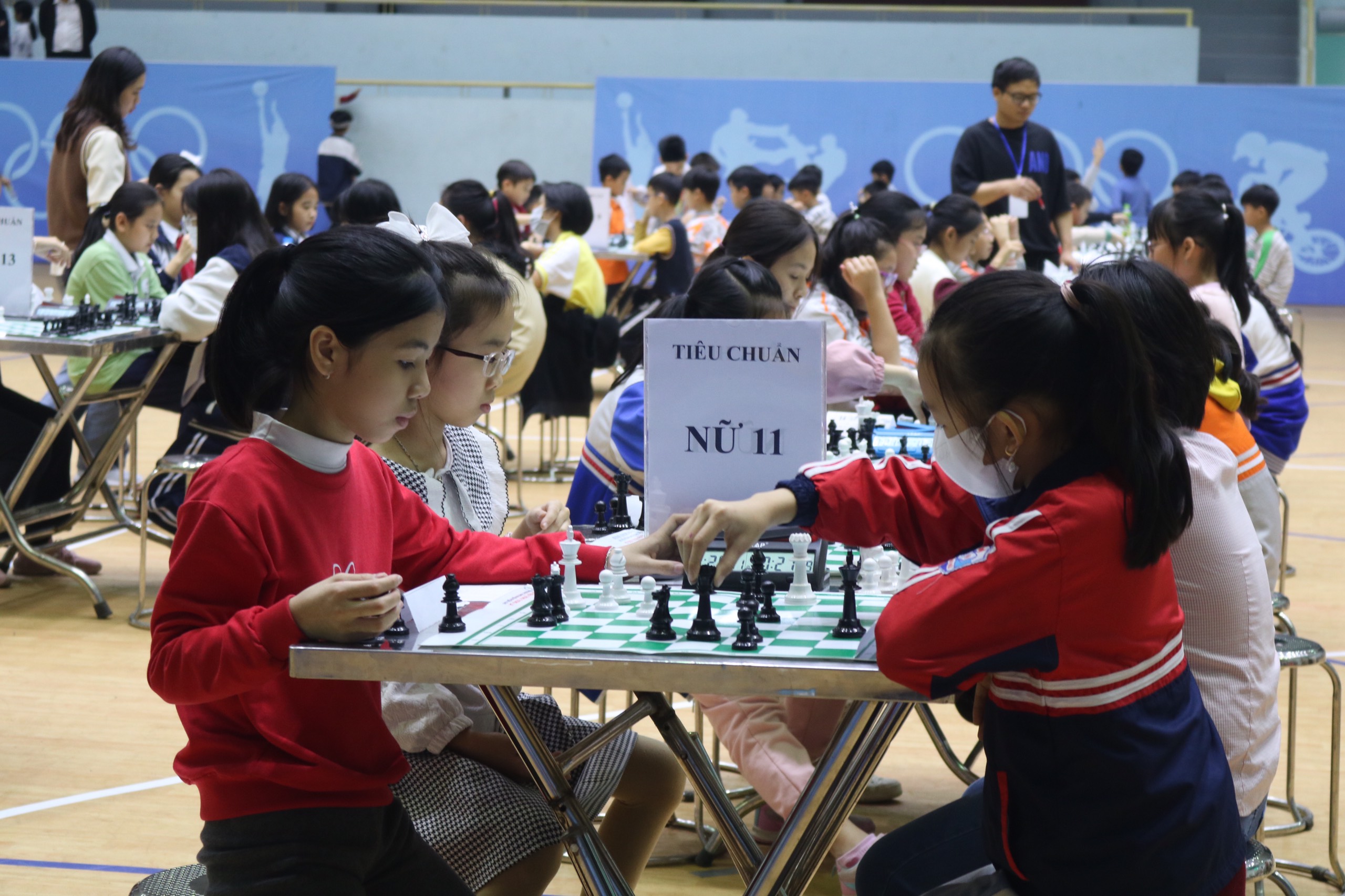 A group of children playing chessDescription automatically generated